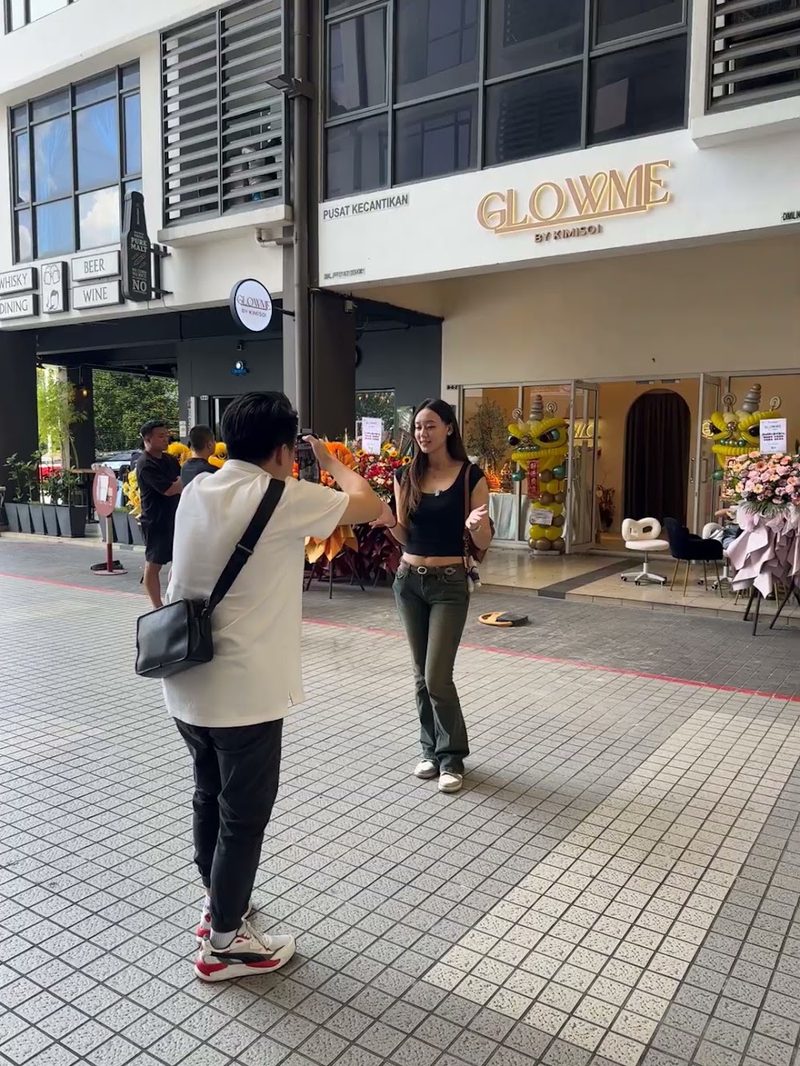Filming a storefront ad on the street